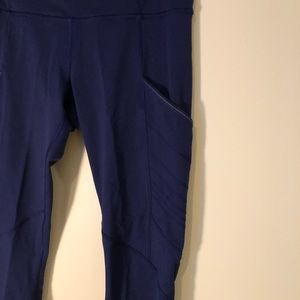 Blue workout leggings with pockets.
